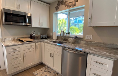 Fort Myers Beach House | Times Square Gem! 4BR Canal front home, private Pool/Spa, Sleeps 12