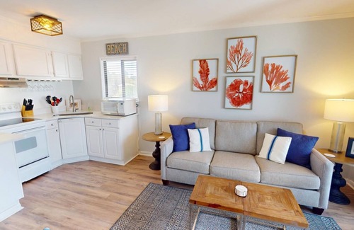 Tybee Island Condo | Top floor condo w. partial ocean + community pool views.