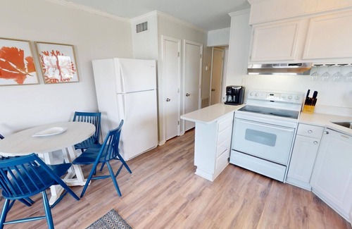 Tybee Island Condo | Top floor condo w. partial ocean + community pool views.