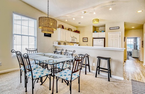 Sunset Beach Condo | Top-floor, end-unit condo with water/golf course views, pools, tennis, & grills