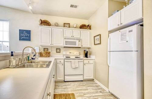 Sunset Beach Condo | Top-floor, end-unit condo with water/golf course views, pools, tennis, & grills