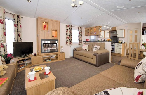 Burnham-on-Sea House | Top of the range 12ft-wide caravan with one double and two twin.