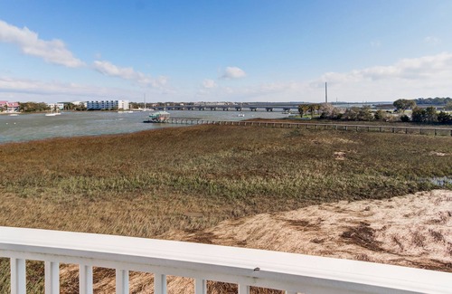 Waters Edge House | Townhouse with marsh and river views, shared pool, & outdoor shower