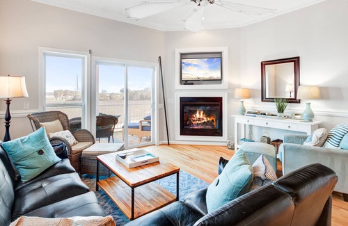 Waters Edge House | Townhouse with marsh and river views, shared pool, & outdoor shower