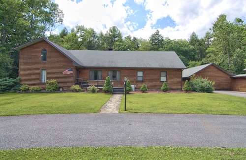 Canadensis Cabin | Tranquil Retreat: Rustic Cabin with Creek, Indoor Pool, and Theater Room