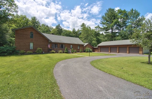 Canadensis Cabin | Tranquil Retreat: Rustic Cabin with Creek, Indoor Pool, and Theater Room