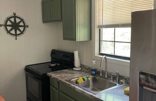 Marble Falls Cottage | Traveler Creek Inn nestled in the woods