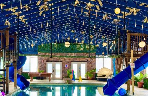 Bryant House | Tri-state Corner Cabin with a fire pit hot tub & indoor pool