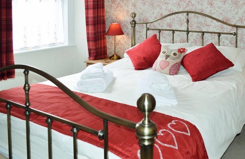 Keswick Cottage | Two Chimneys is an attractive and traditional Lakeland terraced cottage, with Wi-Fi, garden and priv