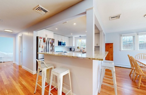 Manomet House | Two-story home near the beach with spacious deck, grill, modern kitchen, & W/D