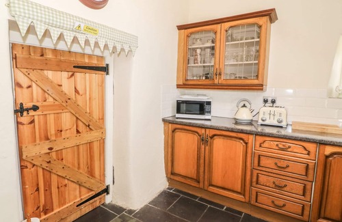 Holyhead Cottage | TY FFERM BODLASAN, family friendly, with open fire in Llanfachraeth