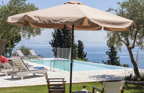 Perama Villa | Unique & Beautifully Restored Villa, A/C, Private Infinity Pool, Fitness Room & Magical Sea Views!