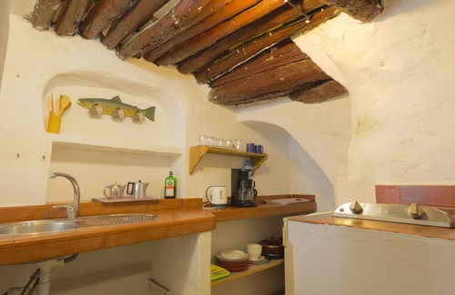 Competa House | Unique stay in a restored olive mill museum.
