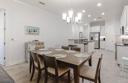 American Beach House | Updated Townhome near the Ocean w/Private Patio, Shared Pool, Central A/C