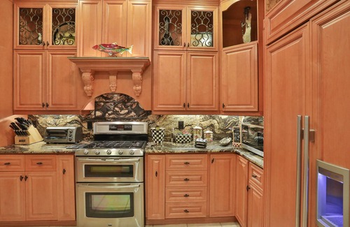 Naples House | Upscale waterfront home with private dock, saltwater pool, lanai, grill, & W/D