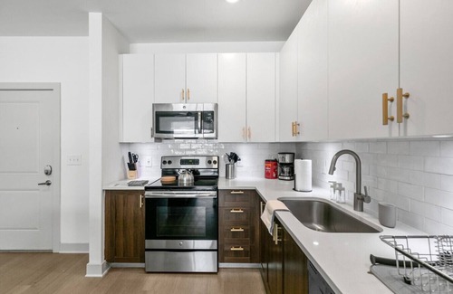 Forest Park Apartment | Urban Elegance: 3BR Condo Experience