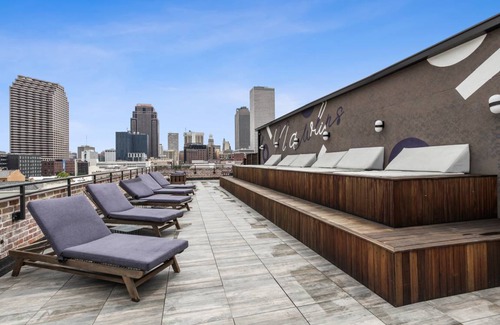 Central Business District Hotel | Sextant The Brandywine Rooftop Pool 5 min drive to Bourbon St 4 Bed 4 Bath