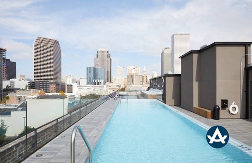 Central Business District Hotel | Sextant The Brandywine Rooftop Pool 5 min drive to Bourbon St 4 Bed 4 Bath