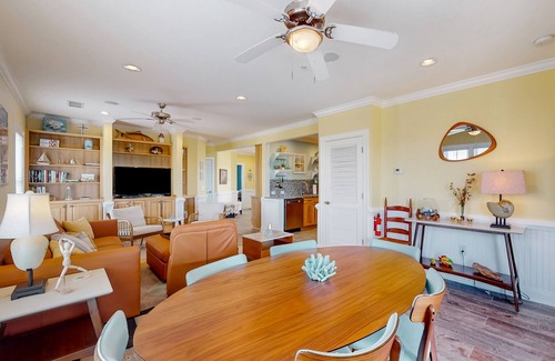Hatteras Condo | Vibrant beach retreat with washer/dryer, central AC, deck, & pool access