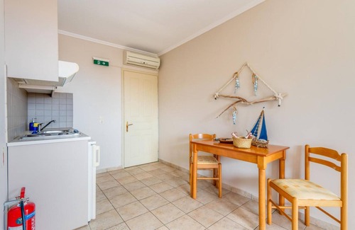 Gaios Apartment | Wake up to stunning sea views at Paxi Apartment in the heart of Gaios