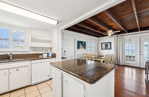 St. George Island House | Wander from the cool shade of the screened porch to the sun deck with your favorite book!