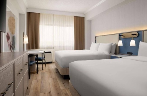 White Plains Hotel | Warm and Comfortable Pets Allowed Two Queen Room w/Pool and Airport Shuttle