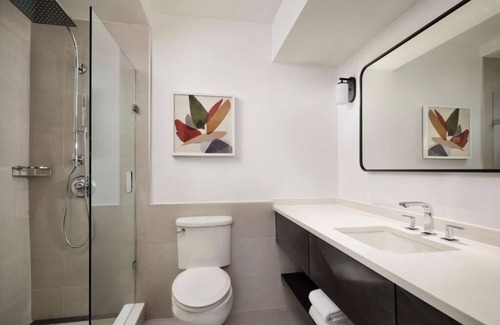 White Plains Hotel | Warm and Comfortable Pets Allowed Two Queen Room w/Pool and Airport Shuttle