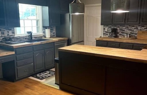 Madison House | Warm and cozy four bedroom home with fireplace.