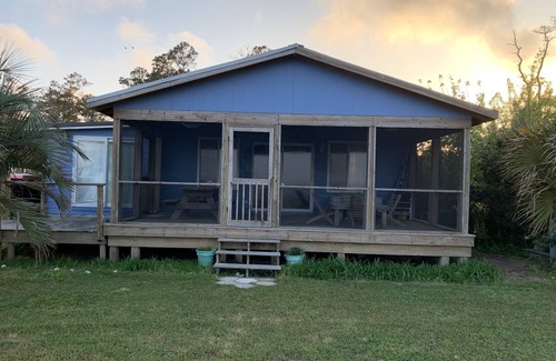 Cedar Island House | Watch the sun rise from this waterfront home.