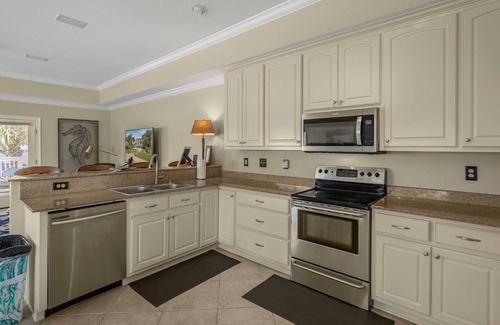 Orange Beach Villa | Water front home with boat dock, boat use, fishing swimming biking & more