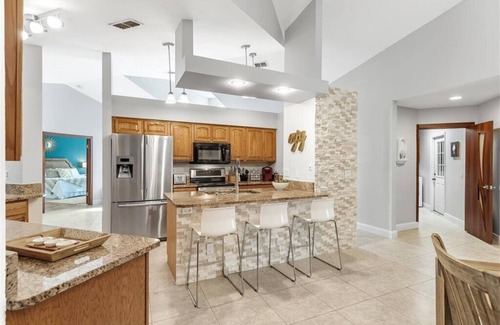 Pelican House | Waterfall saltwater Lagoon heated pool, 2 King Suites, Sauna!