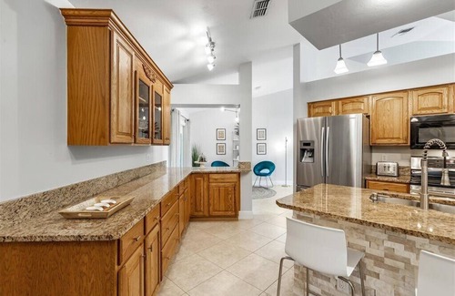 Pelican House | Waterfall saltwater Lagoon heated pool, 2 King Suites, Sauna!