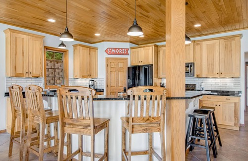Eagle River House | Waterfront condo with lake views, boat slip, grill, beach, AC, fireplace, & WiFi