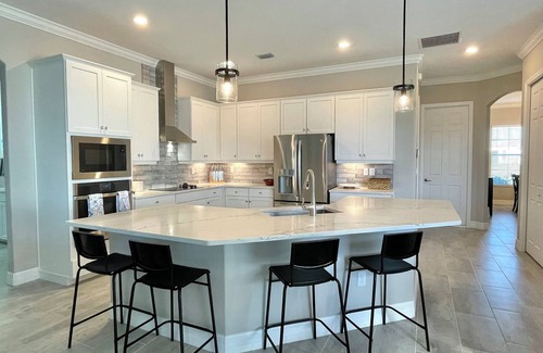 South Gulf Cove House | Waterfront, gated community, heated pool & spa, boat lift, Gulf access, home gym