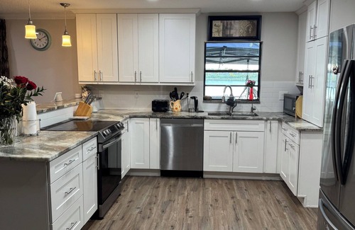 Eustis House | Waterfront Getaway Sauna Hot Tub Jet Skis Sunset Views