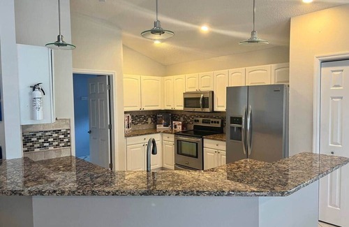 The Villages House | Waterfront, Heated Pool, Golf Cart, & 2 King Beds