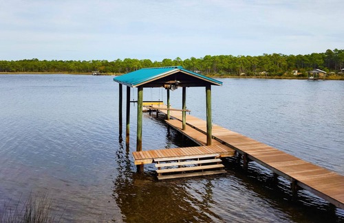 West Panama City Beach House | Waterfront home on Lake Powell with private dock & great deck - near beach & 30A