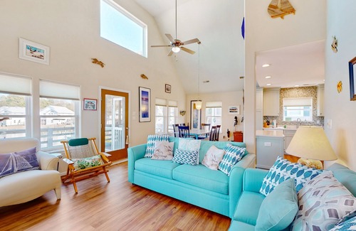 Colington Harbour House | Waterfront home with deck, balcony, outdoor shower, water views, AC
