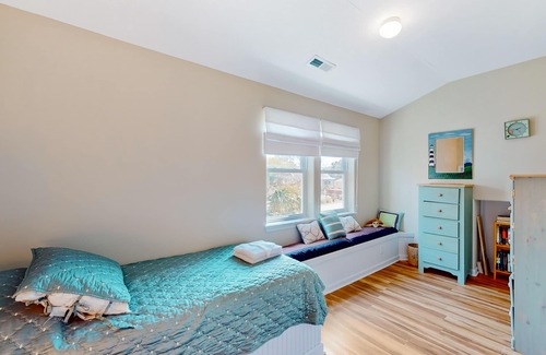 Colington Harbour House | Waterfront home with deck, balcony, outdoor shower, water views, AC
