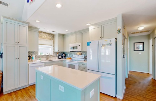 Colington Harbour House | Waterfront home with deck, balcony, outdoor shower, water views, AC