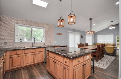 Montgomery House | Waterfront house with a large deck and dock for boat or fishing