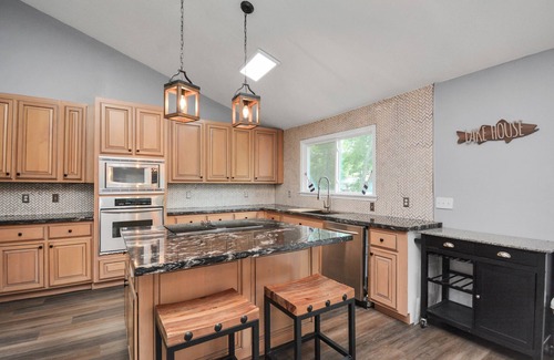 Montgomery House | Waterfront house with a large deck and dock for boat or fishing
