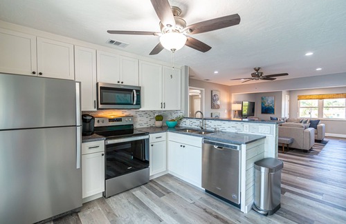 Caloosahatchee House | Waterfront Luxury: 2BR Cape Coral Condo with Pool