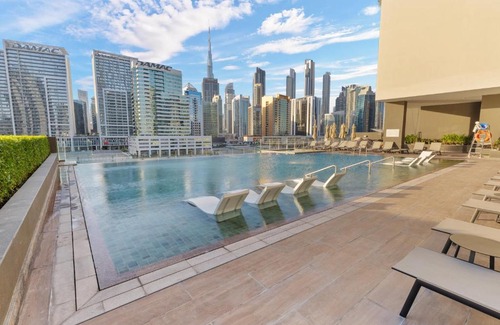 Business Bay Apartment | Waves - Spacious 2BR Apartment with Burj Views & Terrace