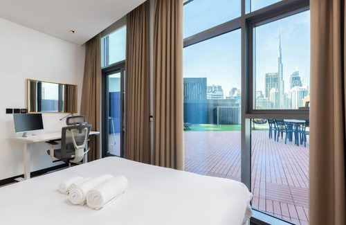 Business Bay Apartment | Waves - Spacious 2BR Apartment with Burj Views & Terrace