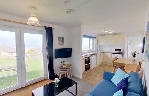 Hayle Cottage | With a bright ocean facing living room and double doors which take in the views towards St. Ives bay