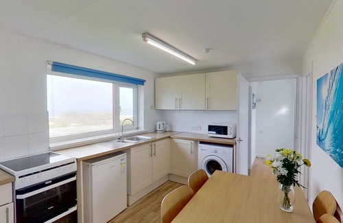 Hayle Cottage | With a bright ocean facing living room and double doors which take in the views towards St. Ives bay