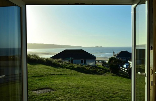 Hayle Cottage | With a bright ocean facing living room and double doors which take in the views towards St. Ives bay