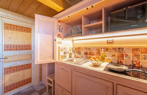 San Brizio Apartment | Wooden house with porch and garden