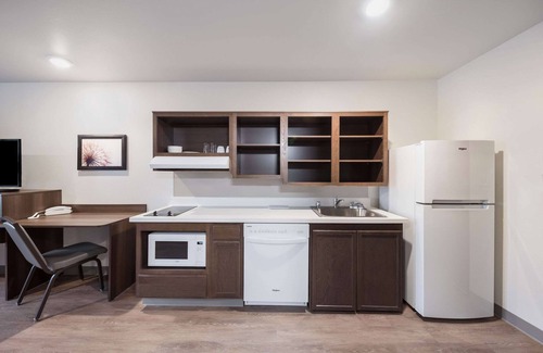 Plano Hotel | WoodSpring Suites Dallas Plano Central Legacy Drive